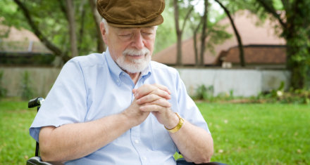 elderly man praying