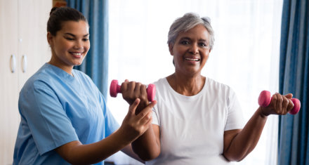 elderly woman lifting barbels