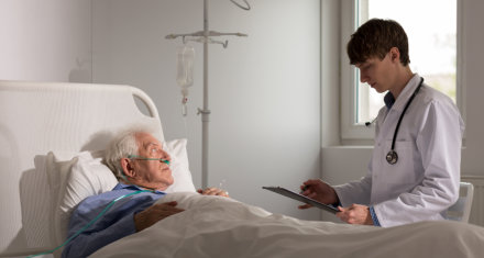 doctor talk to elderly man