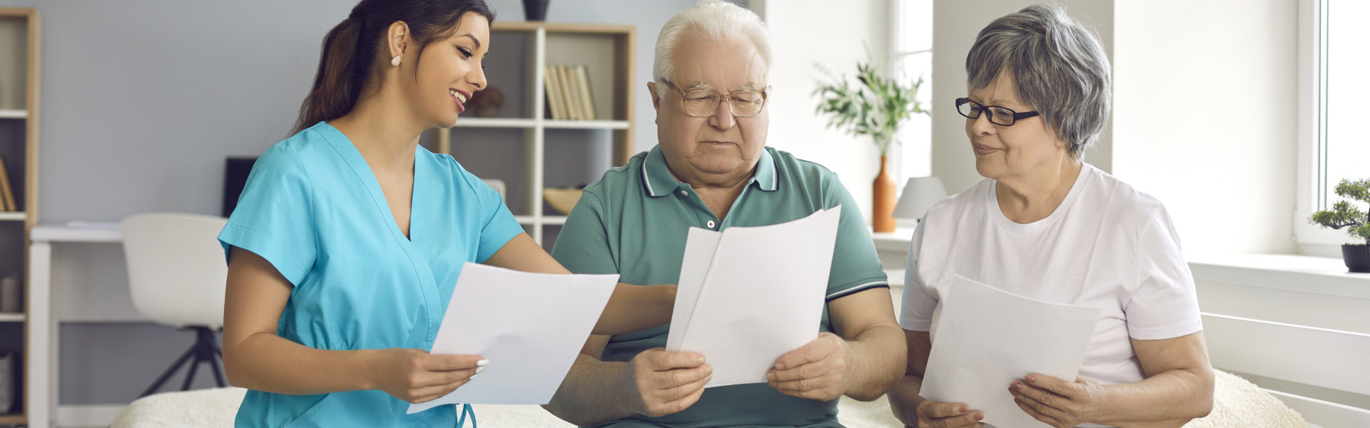 elderly couple read documents