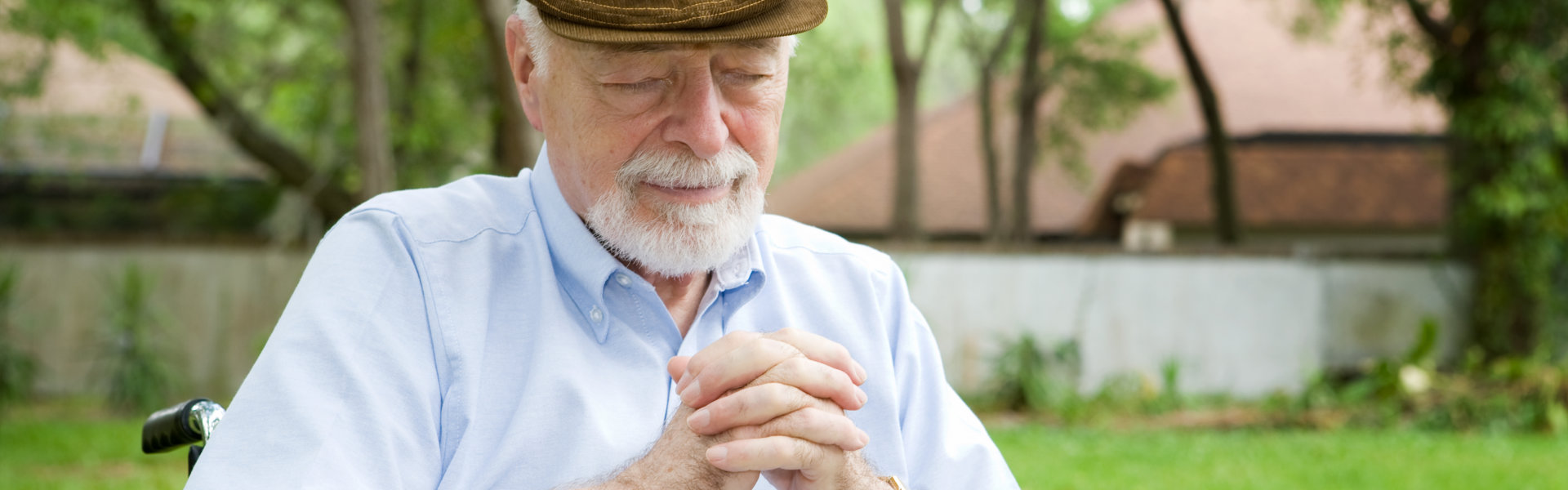 elderly man praying