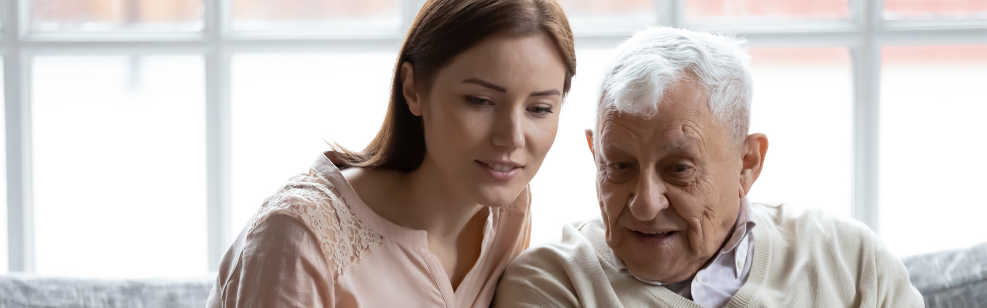 caretaker talk to elderly man