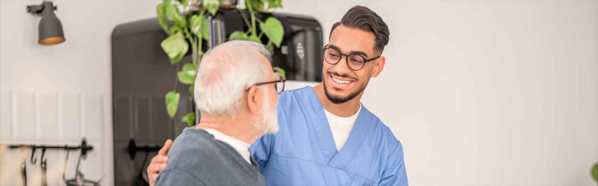 caretaker smile at elderly man